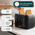 Black four-slice toaster with browning, defrost, reheat and removable crumb tray