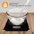 Digital kitchen scale with bowl measuring milk in ml or fl.oz, Aquatronic feature shown