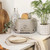 Taupe 4-slice toaster with slices of bread, shown on kitchen counter