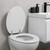 White wood-effect toilet seat in modern bathroom, lid open