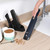 Handheld vacuum cleaner crevice tool cleaning edge of wooden floor and skirting board