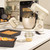 Cream stand mixer with 10 speed settings dial