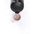 Black electric kettle pouring hot water into pale pink mug, product demo