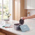 Heart-shaped waffle maker plates in blue storage box on kitchen worktop
