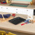 Black non-stick baking tray, rectangular, embossed with Russell Hobbs logo, shown flat