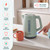 Green electric kettle with mug, showing fast boil and key features