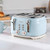 Four-slot light blue toaster with chrome controls on kitchen counter