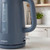 Blue electric kettle with water level indicator, shown on kitchen countertop