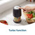 Black mini food chopper with turbo button, chopping diced vegetables