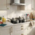 Grey saucepan and casserole set on hob in modern kitchen, showing cookware style and layout