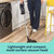 Person using a cordless vacuum on a kitchen floor
