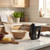 Black hand mixer standing by a mixing bowl on a modern kitchen worktop