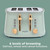 Sage green 4-slice toaster with wood-effect controls and browning levels graphic