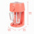 Pink blender with clear jug on kitchen counter, surrounded by juice cartons and fresh fruit.