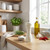 White manual salt grinder shown on kitchen worktop