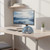 Light blue wireless headphones on desk in modern home office setup