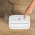 White dehumidifier rear view showing air vent and internal tank