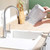 White water filter jug being emptied into a kitchen sink