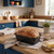 Non-stick loaf tin with fresh brown bread on wooden worktop in bright kitchen.