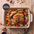 Roast chicken with vegetables in cream oven dish, Lifetime Guarantee badge visible