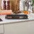 Black non-stick oven tray on kitchen worktop