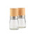 Pair of Russell Hobbs glass salt and pepper mills with light wood lids and brushed metal bands