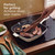 Cream square grill pan on hob with steak, bacon and mushrooms cooking