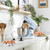 Blue stand mixer with stainless steel bowl and attachments on kitchen counter