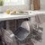 Grey roasting tray and plates in dishwasher, showing easy cleaning feature