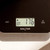 Digital kitchen scale with LCD display showing 176g weight, black Salter model