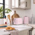 Pastel pink toaster and kettle set on kitchen counter