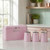 Pink bread bin and matching tea, coffee, sugar canisters on kitchen counter