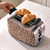 Beige leopard print two-slice toaster with croissants