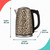 Beige leopard print kettle with dimensions: 25 cm high, 22.6 cm long, 15.4 cm wide