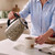Beige leopard print cordless kettle pouring hot water into a mug