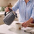 Grey leopard print kettle pouring hot water into a mug