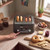 Four-slice black toaster with bagels and browning controls on a kitchen worktop