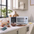 Light blue microwave on kitchen counter with baking ingredients