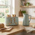 Sage green Salter toaster with four slices and matching electric kettle on kitchen counter