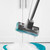 Blue sponge mop head with handle above a green bucket of soapy water