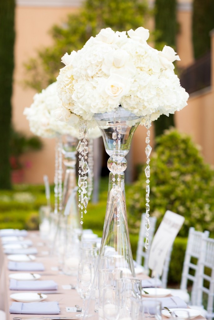 Low glam wedding centerpieces of blush and ivory floral and white feathers  designe…