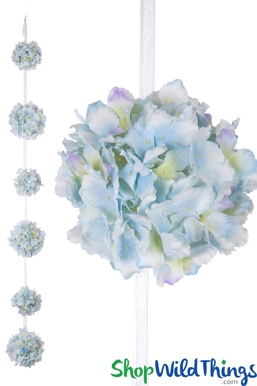 Image of Mix of pink, blue, and white hydrangeas hanging from a hook