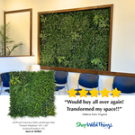 Framed artificial greenery wall “Dream Meadow” 40x40 installed in modern office waiting area above chairs, lush faux plant wall decor backdrop from ShopWildThings.com