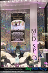 Create a shimmering, eye-catching window display with ShopWildThings' Iridescent Square Sequin Shimmer Backdrop Panels, catching the eyes of everyone who walks by.