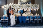 Celebrity Wedding Tablescape with Floating Arch – White Flowers, Dogwood Branches, and Feather Sprays – ShopWildThings.com makes it easy to order by color to match the exact look your design needs!