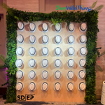 “Paradise” Artificial Greenery Wall Panels and Areca Palm Leaf Sprays by ShopWildThings added the perfect touch of greenery to this Havana Nights themed hat wall!