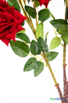 Close-up of green rose leaves and bendable stems on the 34-inch red velvet artificial rose branch, showcasing realistic color and texture.