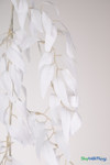 White artificial smilax garland with cascading leaves, photographed vertically to show realistic drape and lightweight vine design