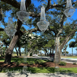 Outdoor Wedding Ceremony with "Tillie" Crystal Beaded Chandeliers and Clear Acrylic Wedding Arch by ShopWildThings.com