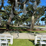 "Tillie" Crystal Beaded Chandeliers Suspended for an Outdoor Wedding with ShopWildThings.com Clear Acrylic Wedding Arch "Tillie" Crystal Beaded Chandeliers Suspended for an Outdoor Wedding with ShopWildThings.com Clear Acrylic Wedding Arch